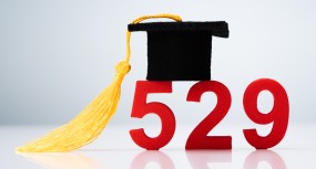 529 Number Showing College Saving Plan Concept With Graduation Hat